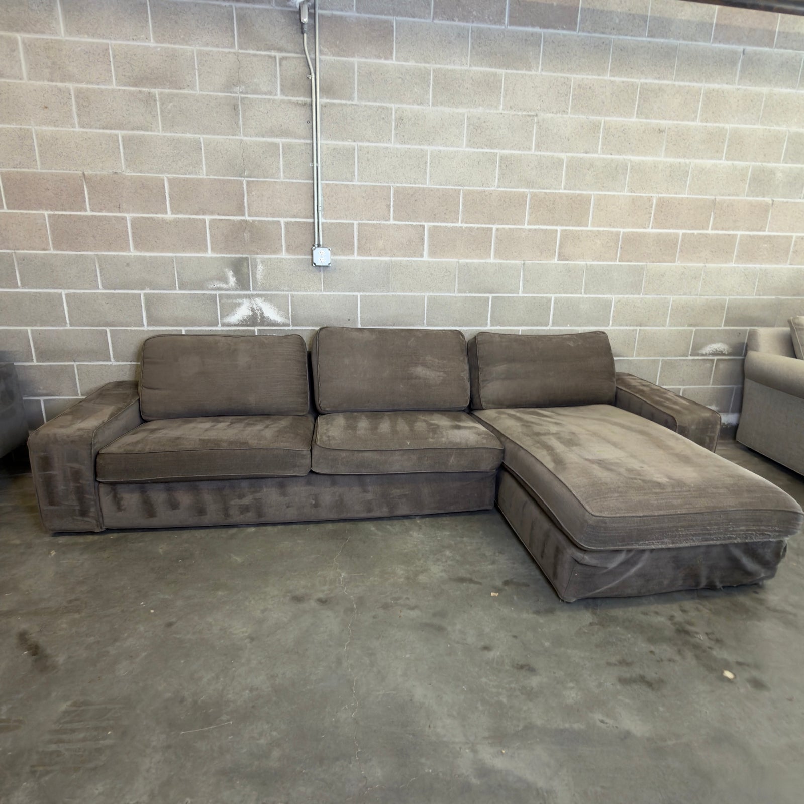 Used brown IKEA Kivik two-piece sectional with chaise, for sale at Couch Potato Furniture in Hayward, California