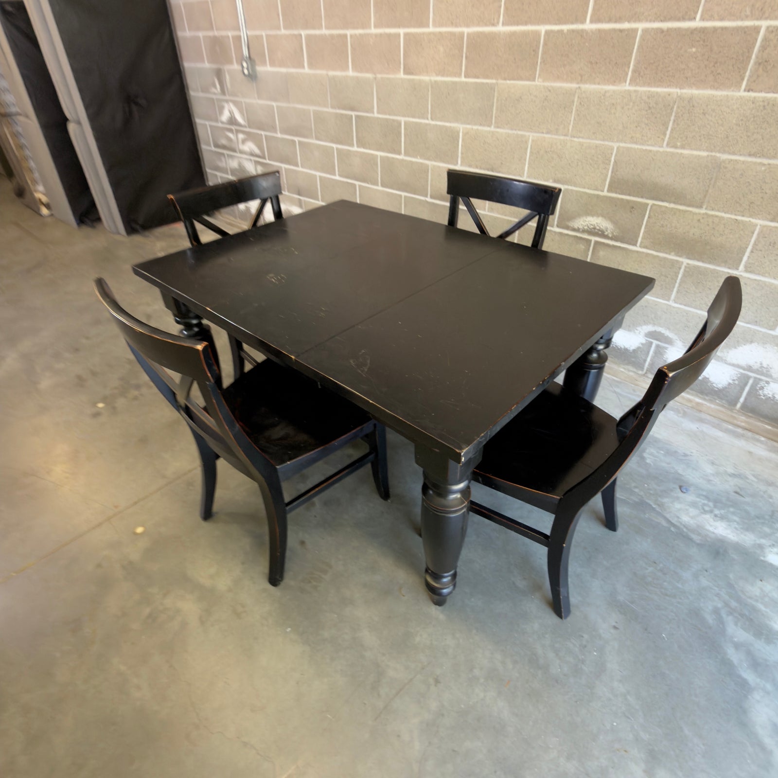 Pottery Barn Amherst black dining set - three-quarter view