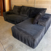 Black oversized corduroy sectional with chaise - three-quarter view