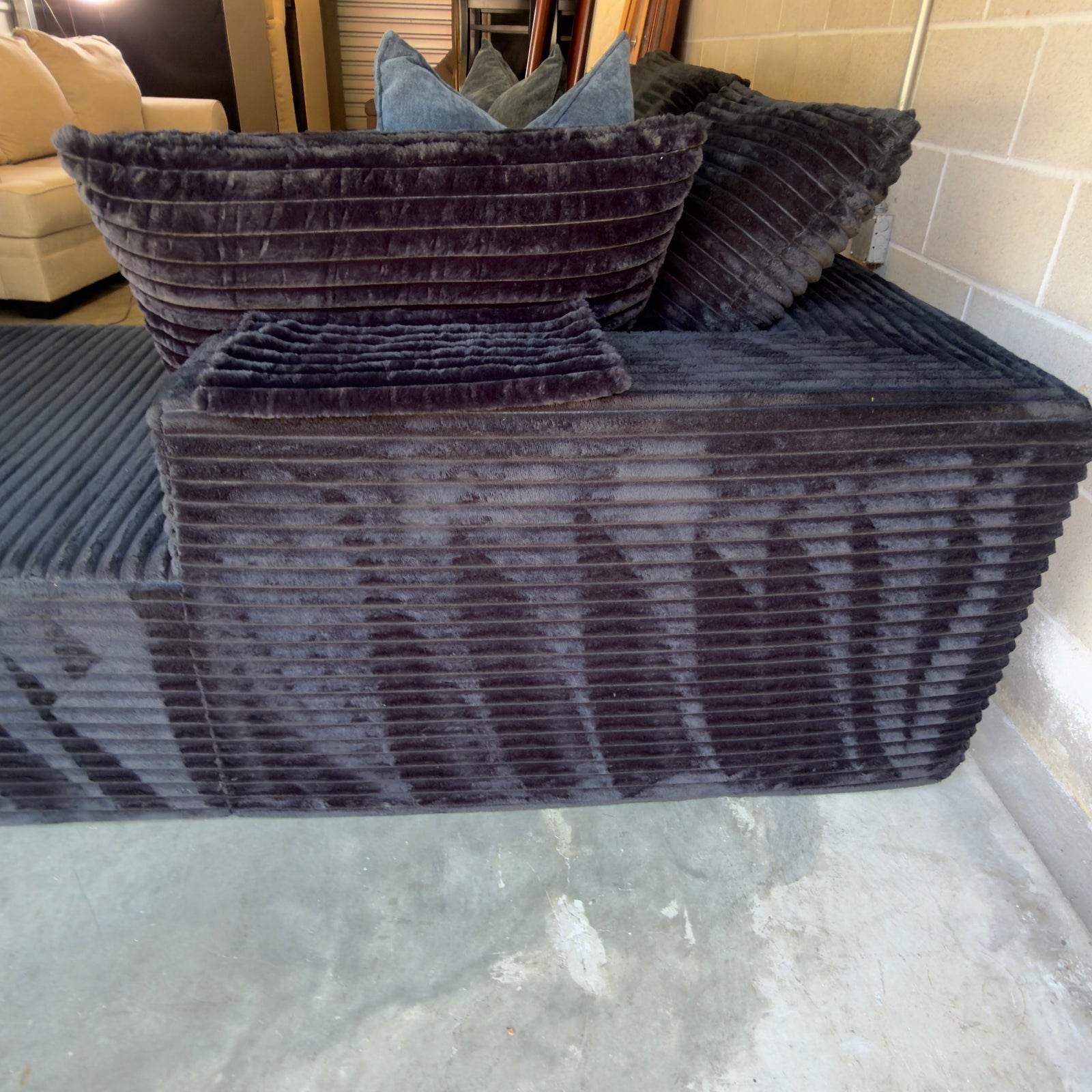 Black corduroy sectional - corduroy pile and back upholstery detail