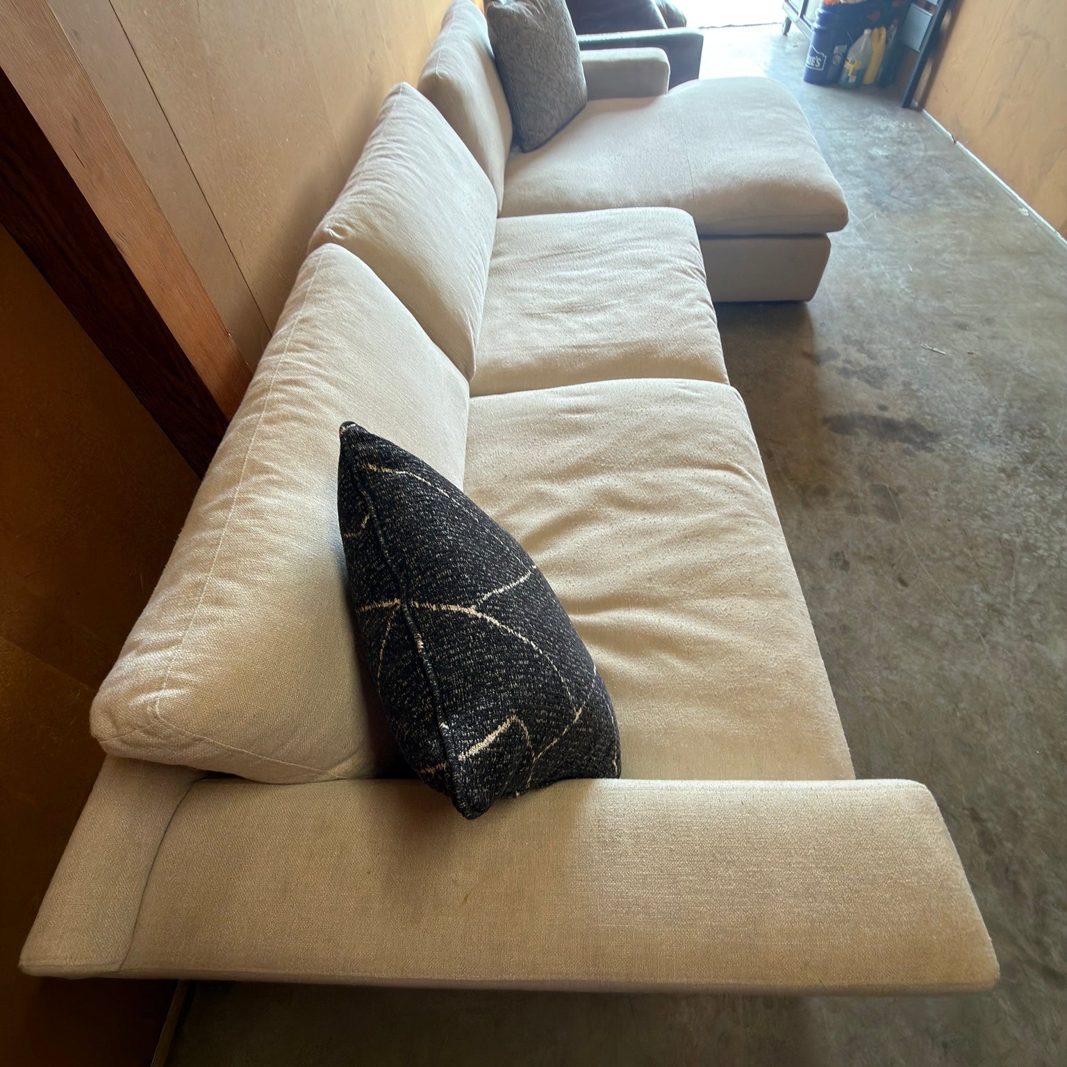 Ashley Furniture Elyza cream sectional - elevated seating and arm view