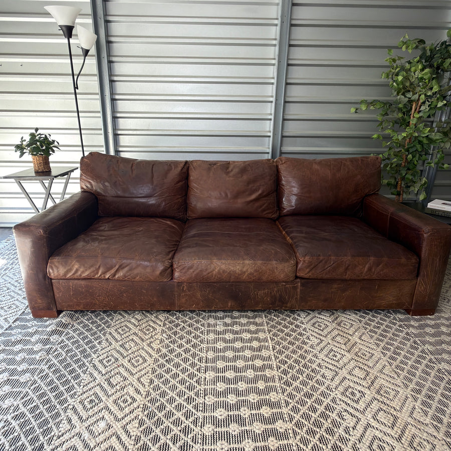 Restoration Hardware Maxwell 90” Distressed Brown Top-Grain Leather Sofa - straight-on staged front view