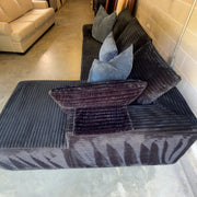 Black corduroy sectional - chaise and padded arm detail