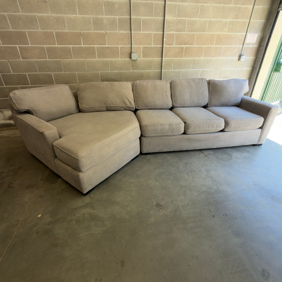 Used gray two-piece sectional couch with chaise by Living Spaces, for sale at Couch Potato Furniture in Hayward, California