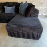 Black corduroy sectional - chaise cushion and front section detail