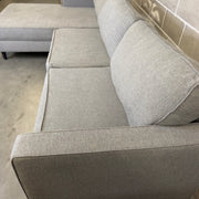Close-up of gray upholstery fabric texture on the Living Spaces Calais III sectional sofa
