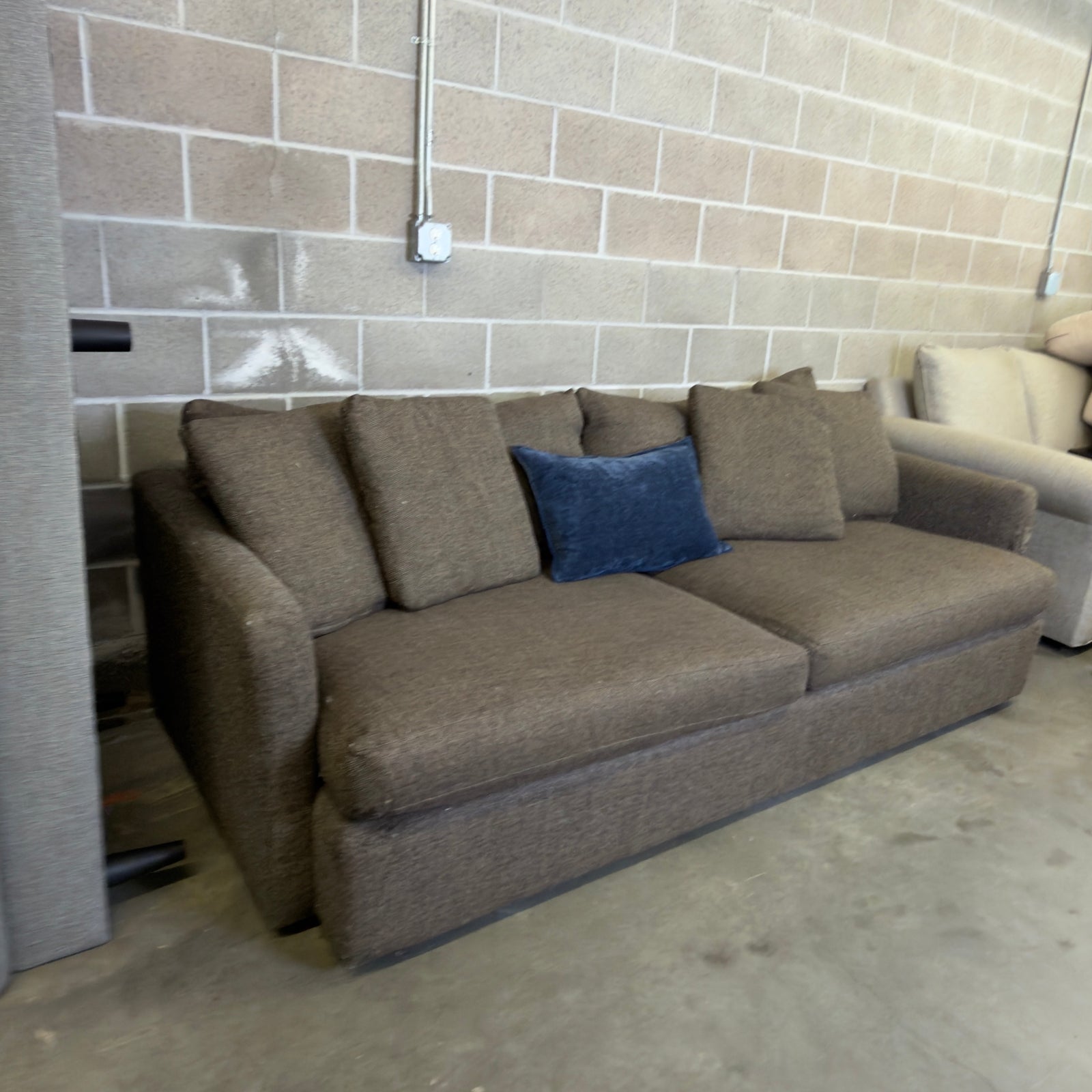 Brown Crate & Barrel tweed sofa, angled view