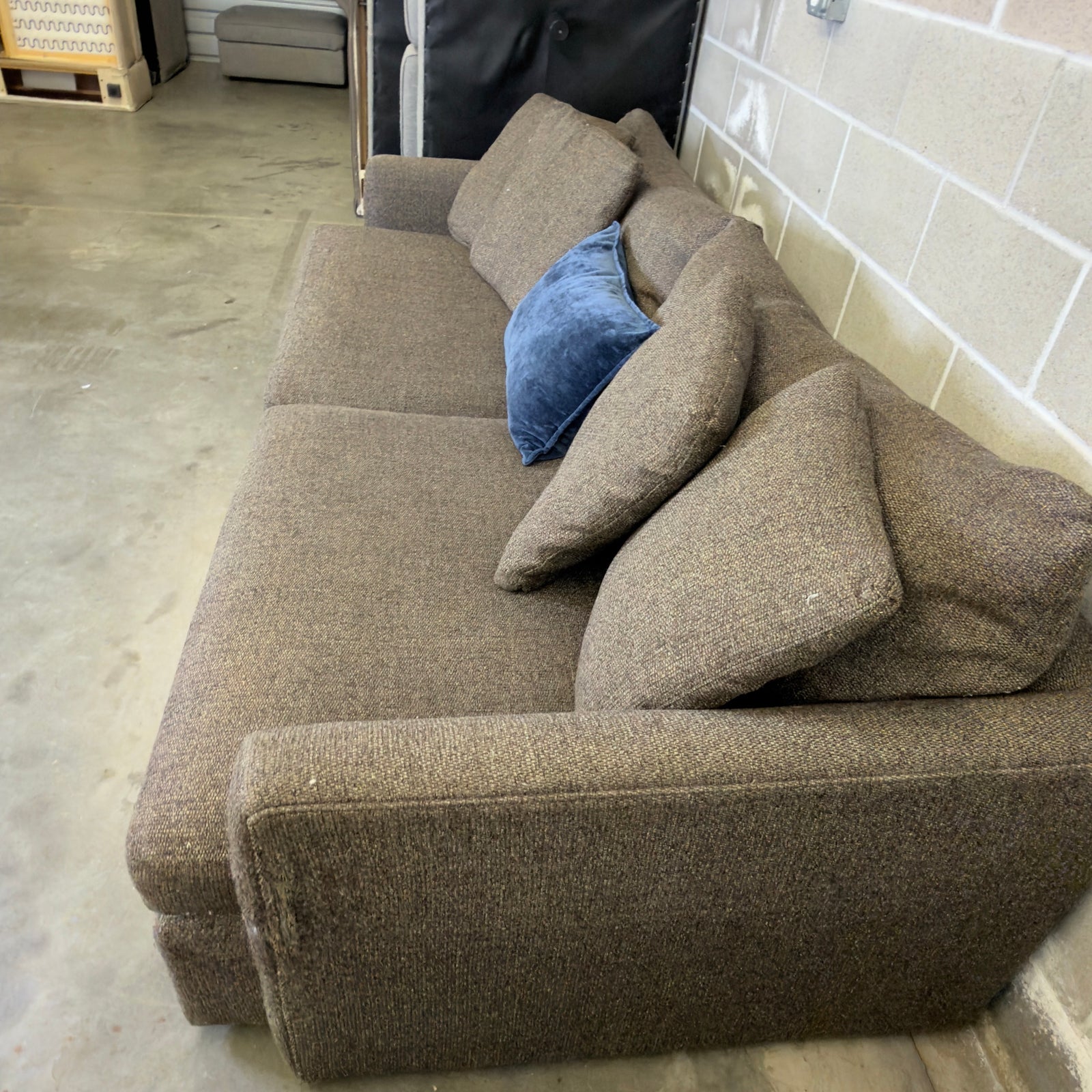 Brown Crate & Barrel tweed sofa, side angle view