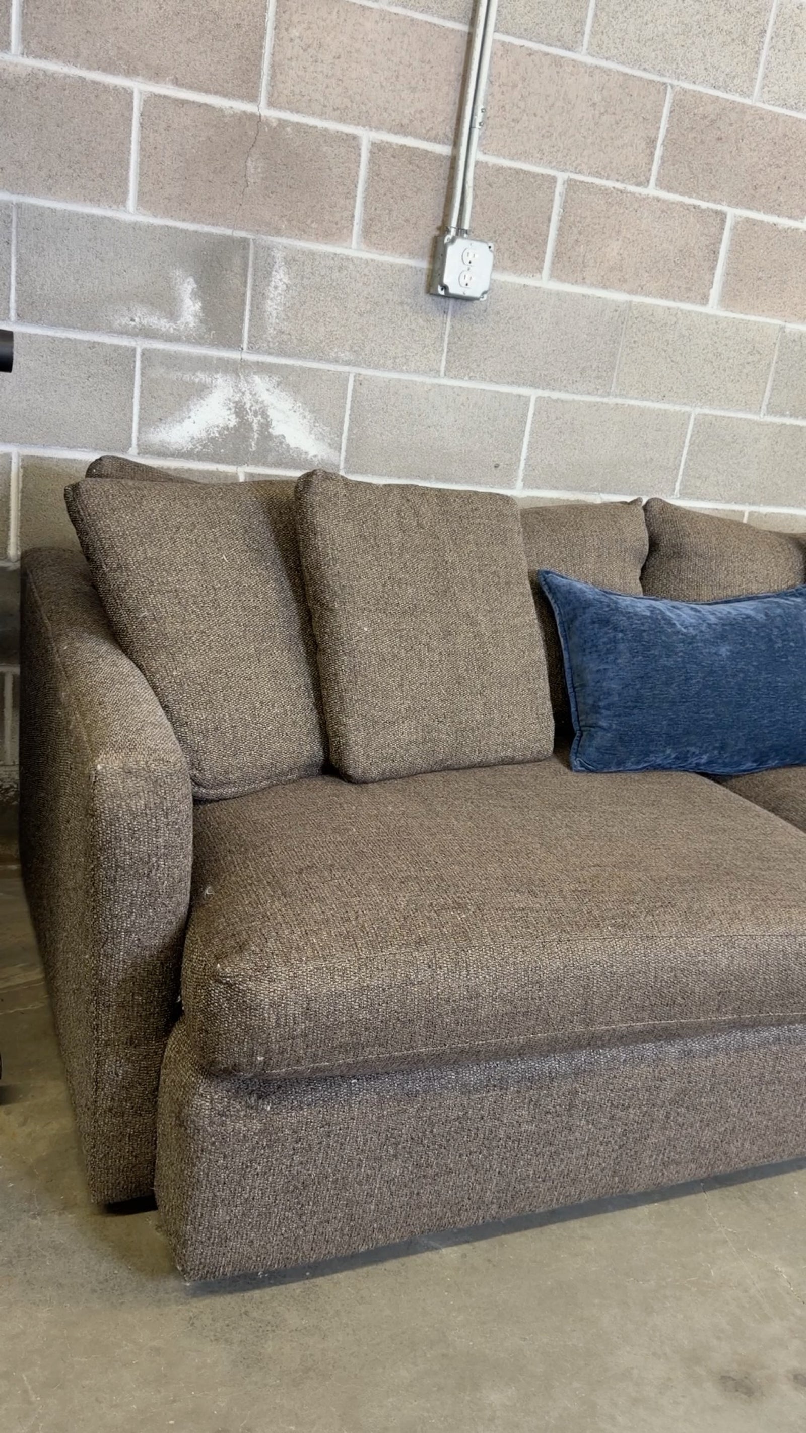 Brown Crate & Barrel tweed sofa, wide view showing arm corner wear