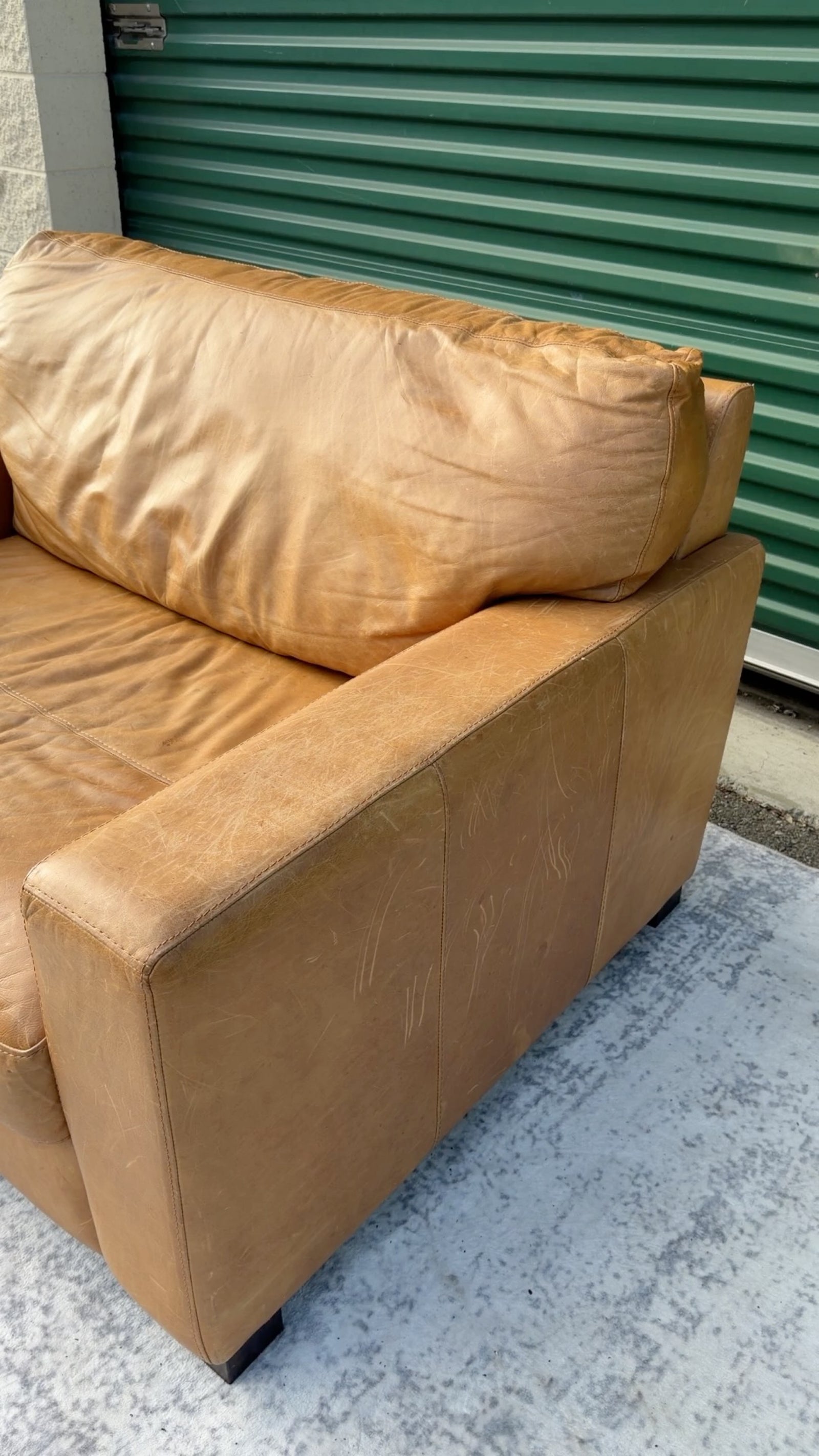 Cognac leather oversized club chair, back corner view